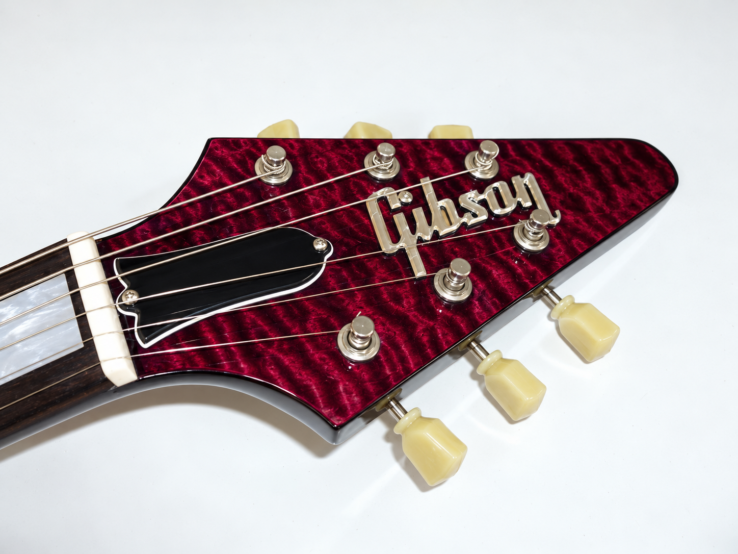 Front headstock detail of the purple quilt-top Flying V
