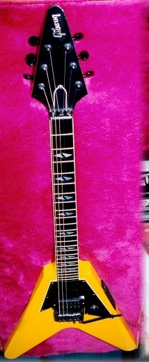 Yellow single-pickup Gibson V90, front and headstock view